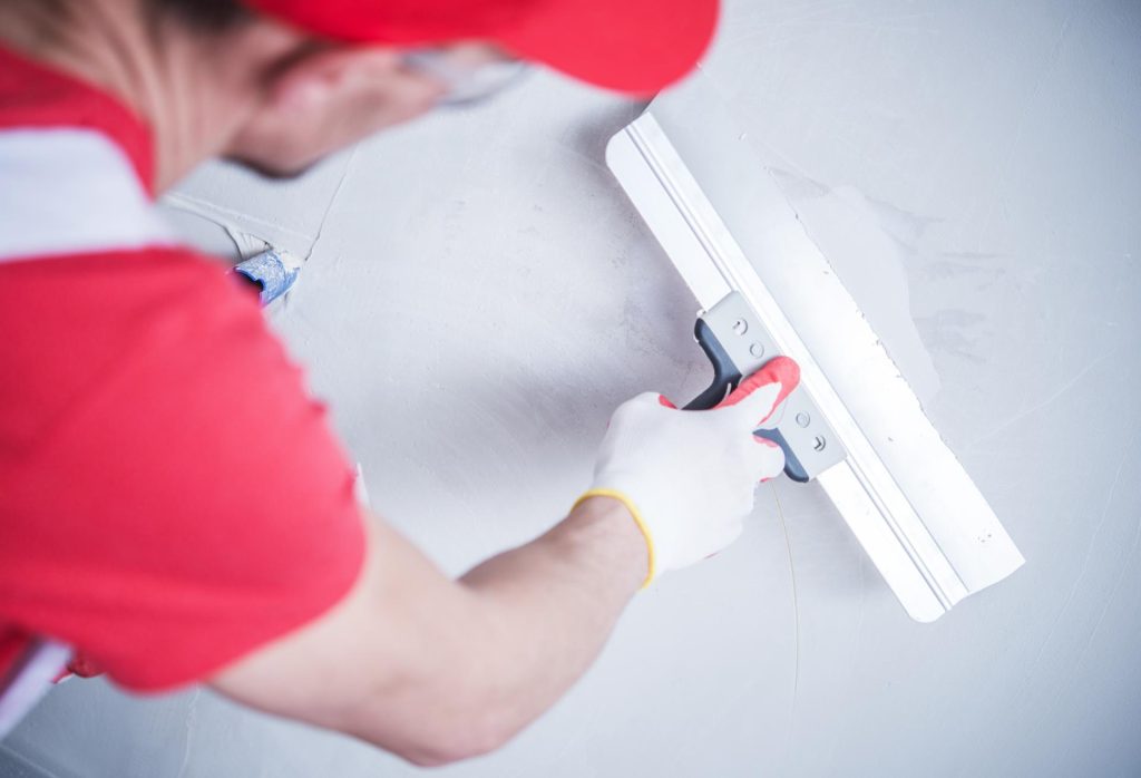 Man plastering a wall