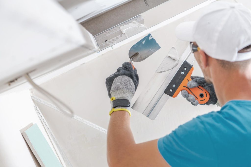 Man plastering a wall