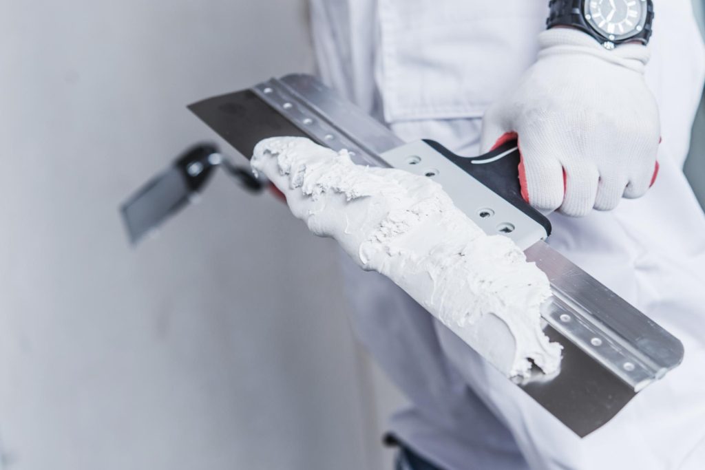Man plastering a wall