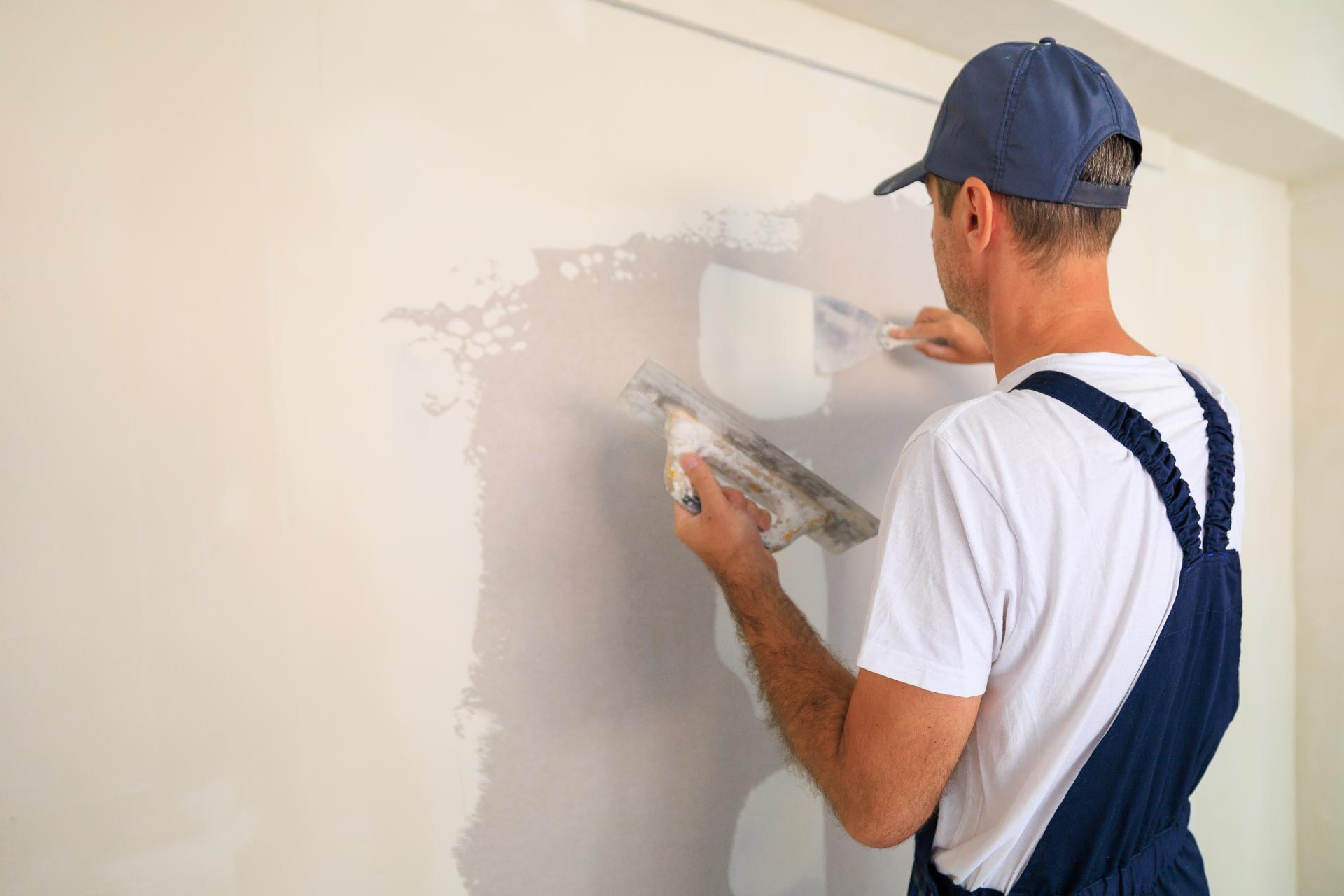 Man plastering a wall