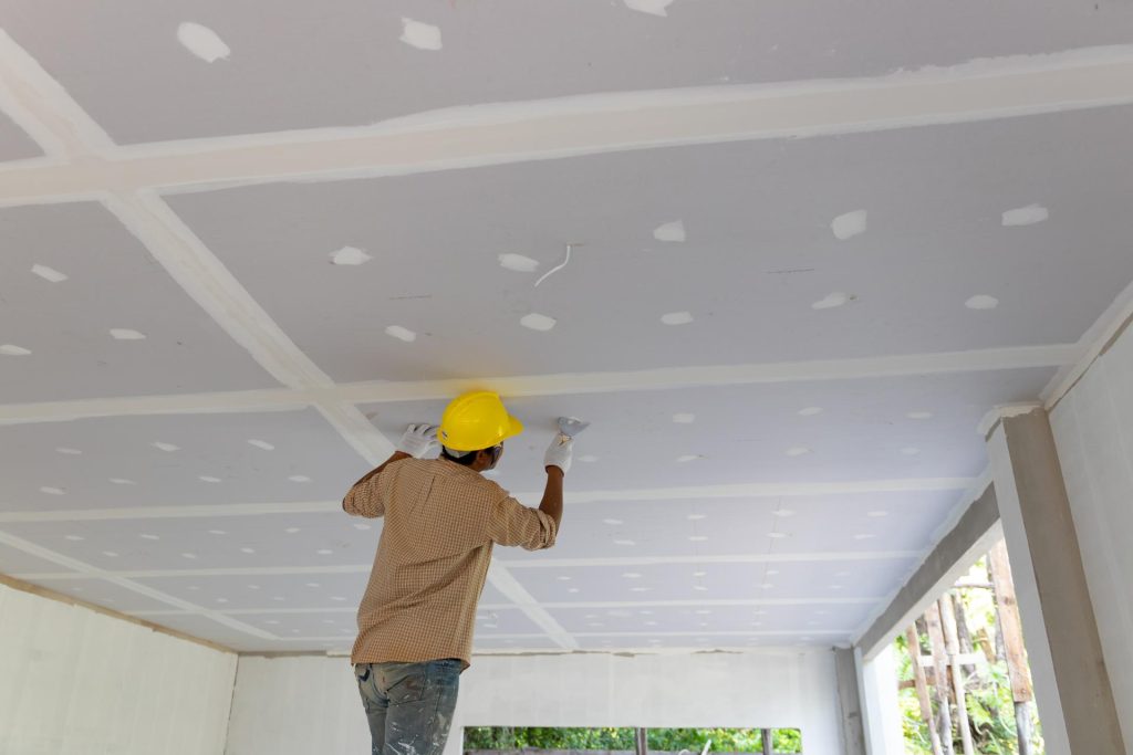 Man plastering a wall