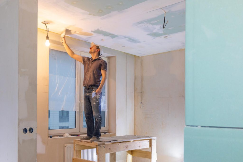 Man plastering a wall